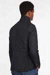 Pikowana kurtka Barbour Lutz w ciemnym granacie Model / Zijkant