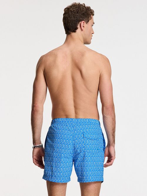 Shiwi Baddräkt Nick Wavy Korallblå Model / Achterkant