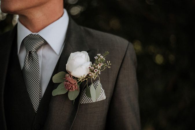 Why do men wear a boutonniere?